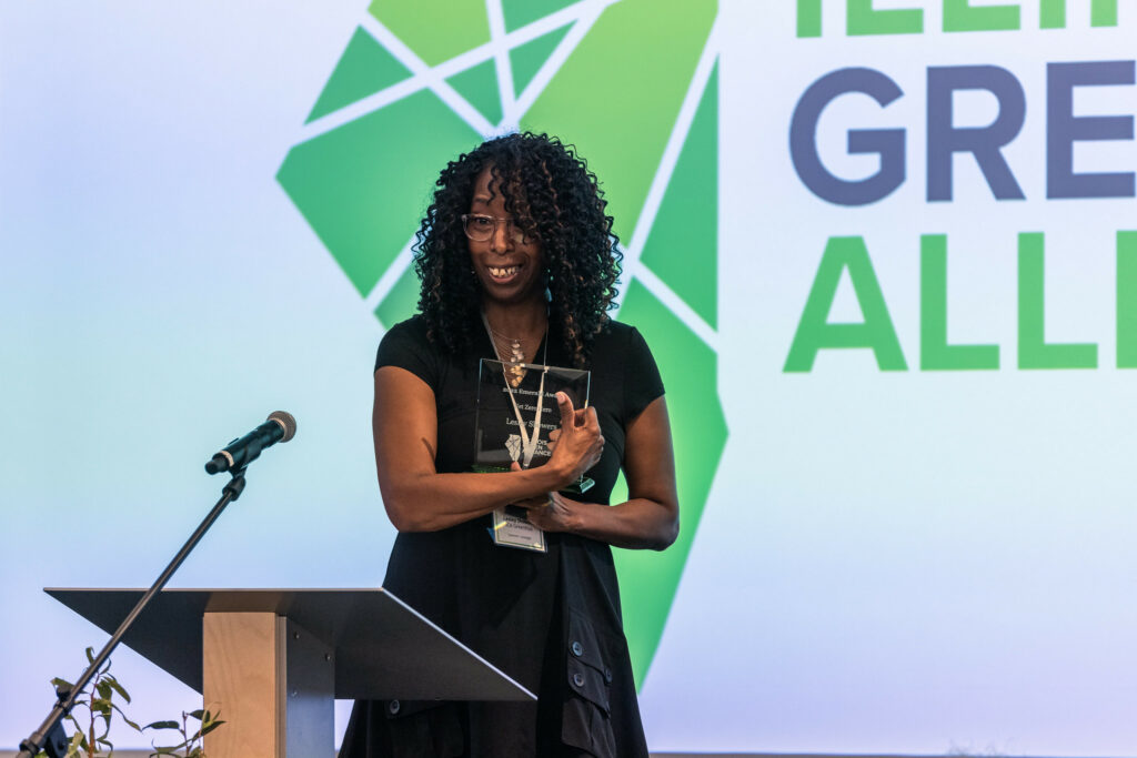 2022 Emerald Award Winner Lesley Showers shows off her award.